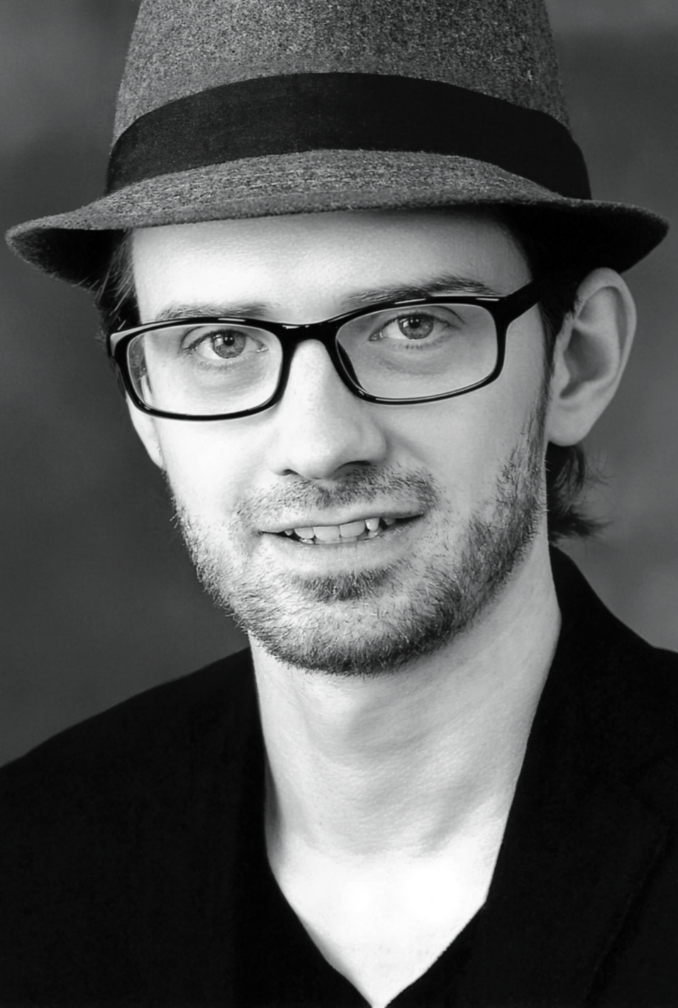Jason David Cook wearing glasses and a hat